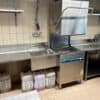 Haubenspülmaschine Meiko EcoStar 545 inkl. Zu- und Wegführtisch